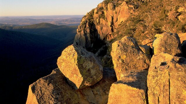 Booroomba Rocks at dusk Tall granite cliffs at dusk