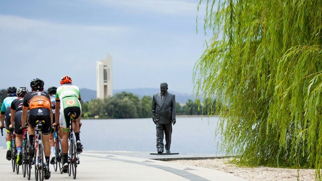 Take the R G Menzies walk your way Group of cyclists going past the R G Menzies statue on the Lake Burley Griffin foreshore