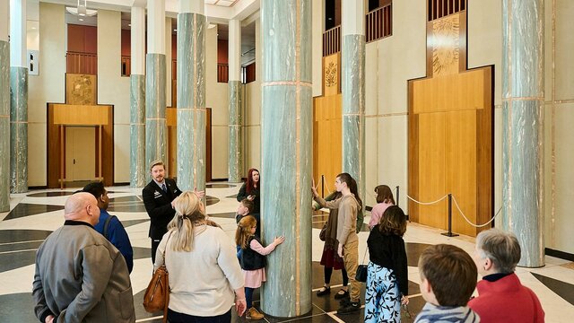 People during a tour in the Marble Foyer of Parliament House