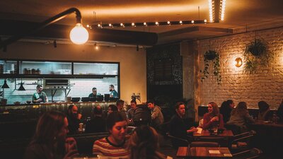Groups of people and friends dining at Assembly, a restaurant and bar located in Braddon.