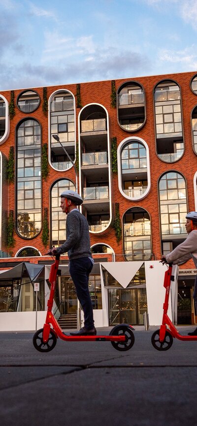 People riding scooters in Braddon