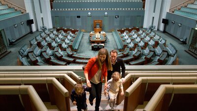 A family inside Parliament House viewing the chamber.