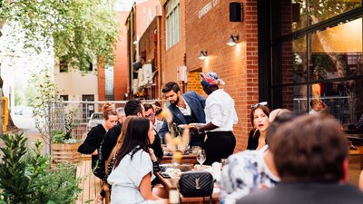 Customers enjoying their meal in the outdoor dining area at Verity Lane Market.