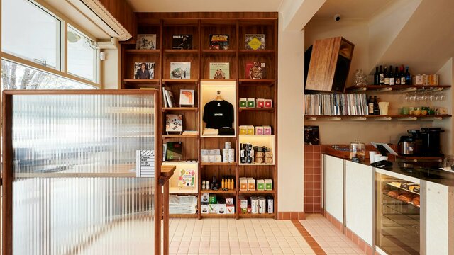 Retail display and front counter this photo shows a retail display of coffee and books, a front counter of a cafe and some vinyl