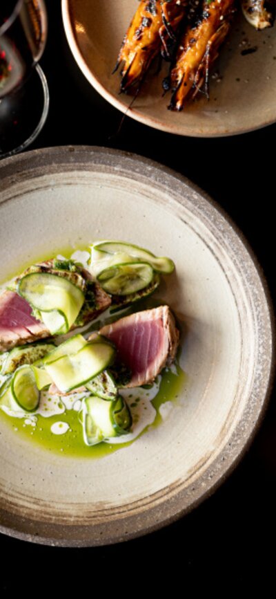 © Ashley St George Aerial of some food dishes on a black table at Temporada | © Ashley St George